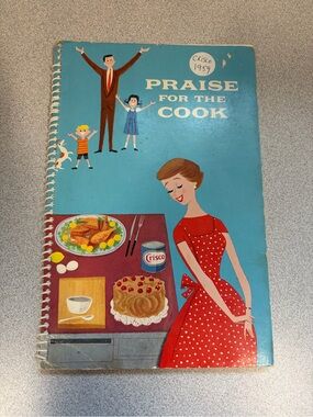 Cisco Cookbook with Bright Blue Cover and Red Polka-Dot Dress Illustration